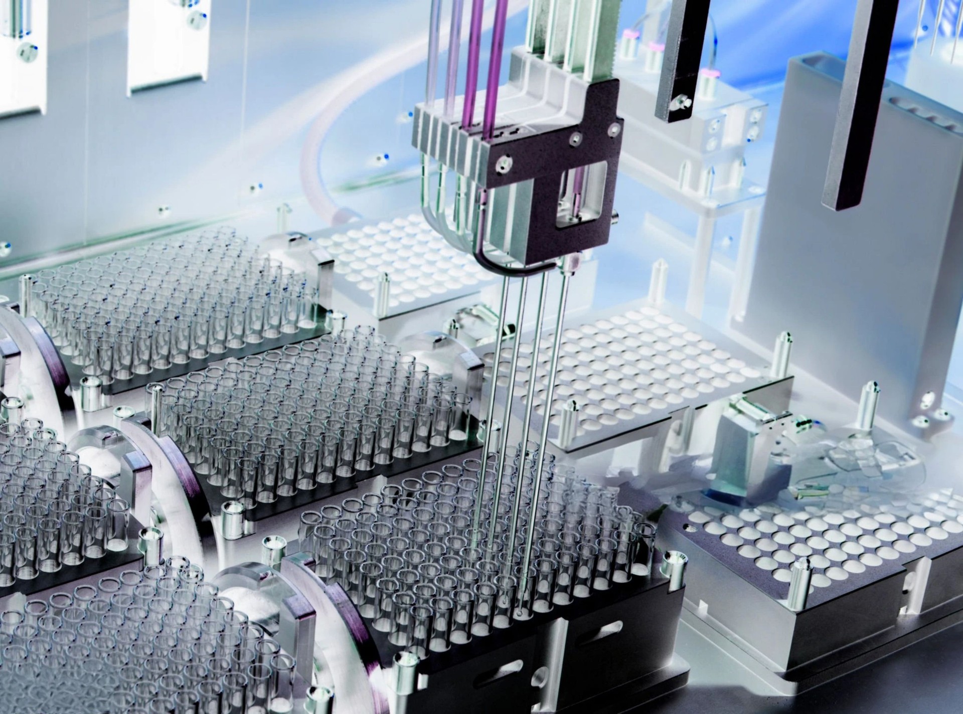 A close-up of an automated lab machine meticulously dispensing samples and solutions.